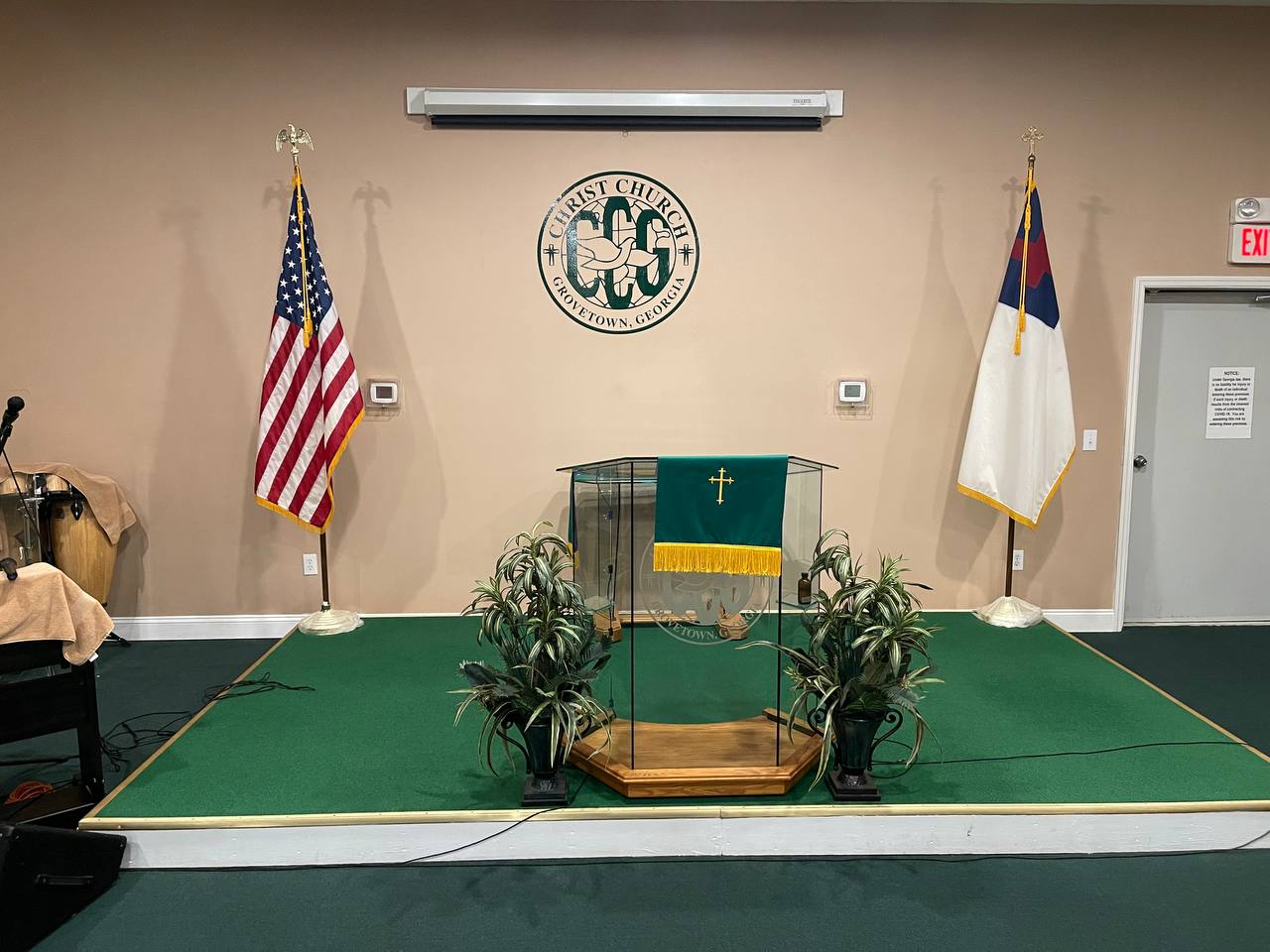 Christ Church of Grovetown sanctuary pulpit with American flag and Christian flag