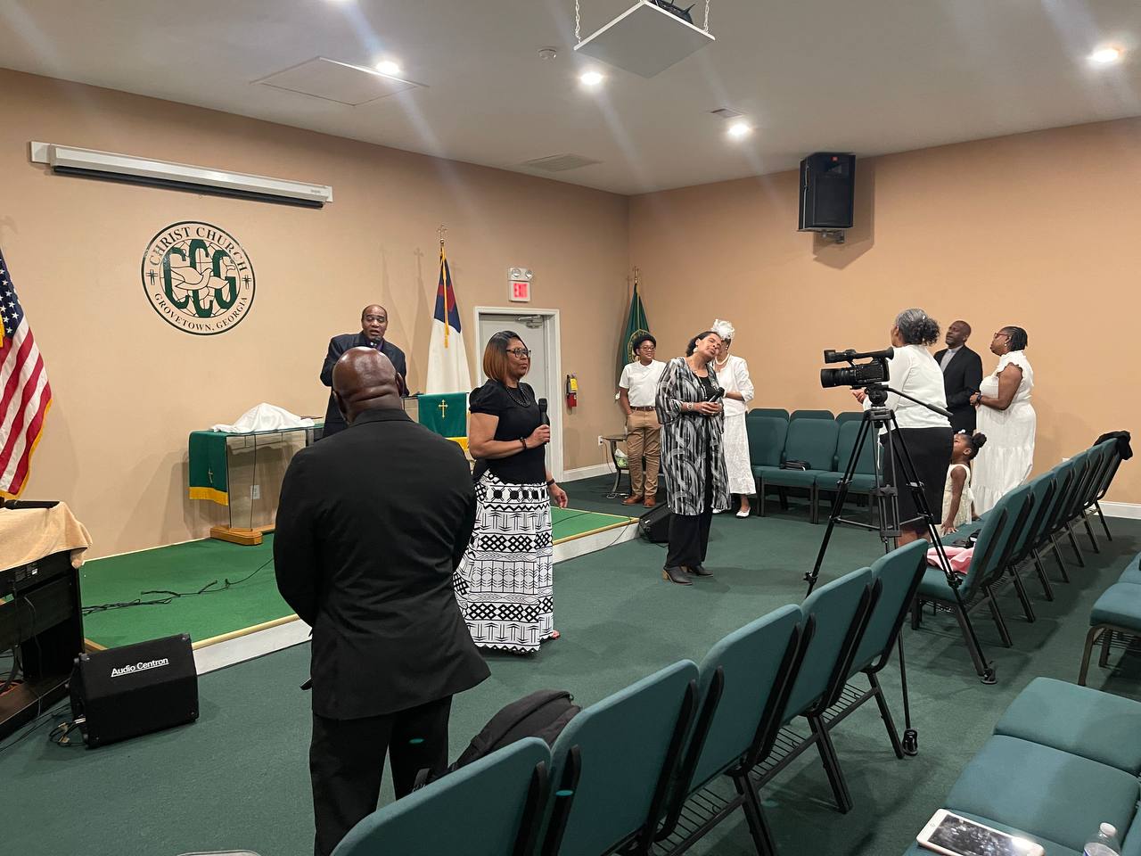 Worship service inside Christ Church of Grovetown with congregation members and livestream camera